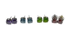 FOUR PAIRS OF STERLING SILVER SIMULATED GEMSTONE POST EARRINGS FEATURING ROUND CUT SIMULATED GEMS