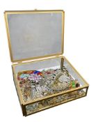 GLASS JEWELRY BOX FEATURING MANY CHAIN NECKLACES, RHINESTONE PIECES, TIARAS, AND MORE
