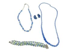 BLUE CRYSTAL JEWELRY INCLUDING TWO NECKLACES, BRACELET, AND CLIP-BACK EARRINGS