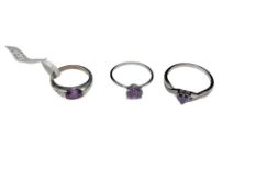 THREE STERLING SILVER AMETHYST FASHION RINGS