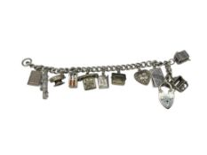 VINTAGE STERLING SILVER CHARM BRACELET FEATURING MANY MOVEABLES, PUFFY HEART, AND OTHER CHARMS