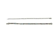 TWO STERLING SILVER TENNIS BRACELETS INCLUDING ONE WITH EMERALD CUT BLUE TOPAZ