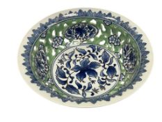 BLUE AND WHITE CHINOSERIE PIERCED PORCELAIN BOWL WITH TRADITIONAL FLORAL DESIGN