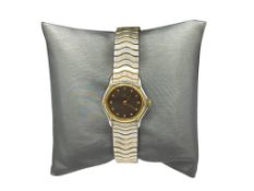 LADIES EBEL DESIGNER WRISTWATCH FEATURING AN 18K YELLOW GOLD ACCEENTED STAINLESS STEEL CASE