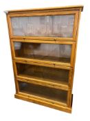 CONTEMPORARY FOUR TIER BARRISTER / LAWYERS STYLE BOOKCASE WITH GLASS FRONT DOORS