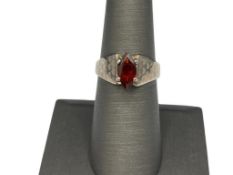 STERLING SILVER MARQUISE CUT GARNET LOVE RING FEATURING HEART PATTERN ON SHOULDERS OF SHANK