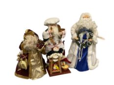 THREE COLLECTIBLE CHRISTMAS HOLIDAY SNATA CLAUS DECORATIONS INCLUDING TWO TREE TOPPERS