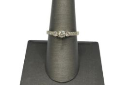 14K WHITE GOLD DIAMOND ENGAGEMENT RING FEATURING THREE TAPERED SET ROUND BRILLIANT CUT DIAMONDS