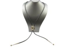 NAVAJO STERLING SILVER ONYX CONCHO BOLO TIE