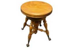 ANTIQUE ROUND BIRCH PIANO STOOL, ADJUSTABLE SCREW HEIGHT WITH CLAW AND GLASS BALL FEET