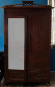 A Grand Anglo-Indian Mirrored Wardrobe with Pierced Gallery and Stylized Carving