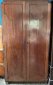 An Art Deco Combination Wardrobe with Geometric Paneling and Curved Frieze
