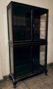 A Formal Anglo-Indian Four-Door Glazed Cabinet on Lion Paw Feet