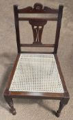 A Federal/Regency Style Side Chair with Stylized Carved Splat and Cane Seat