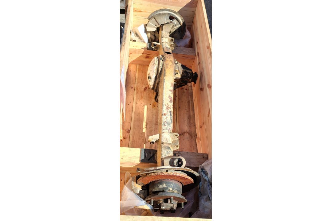 Land Rover RWMIK+ rear axle assembly with brake discs, pads and calipers in wooden storage crate - Image 1 of 9