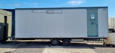 Roll-Along mobile trailer cabin with electrical and plumbing fixtures