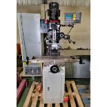 Bench drilling and milling machine mounted on a tool cabinet with spares and accessories
