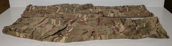 Various types of ex-military camo clothing - may include accessories - 191kg – may require repair