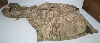 Various types of ex-military camo clothing - may include accessories - 220kg – may require repair