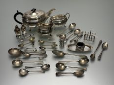 A collection of epns to include a three-piece panel sided tea set, a four-devision breakfast toast