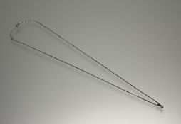 A modern 9ct white gold mounted brilliant cut diamond pendant approximately 0.2ct on 9ct box link