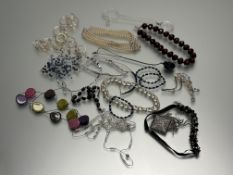 A collection of costume jewellery to include a paste pearl four-strand necklace, a white metal