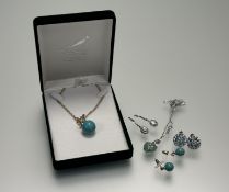 A collection of costume jewellery to include a pair of silver-mounted circular pale topaz