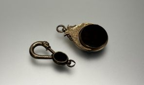 A Victorian 9ct gold engraved revolving fob seal with cornelian and bloodstone circular set