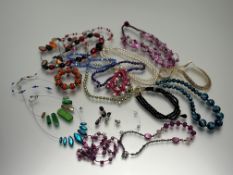 A collection of costume jewellery to include a two-strand paste pearl necklace: l. x 19cm, a gilt