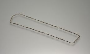 A 9ct gold bar and curb link chain necklace with ring fastening: l. x 38cm 10.26g