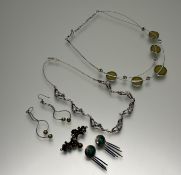 A collection of jewellery to include a Pia silver articulated openwork seven panel necklace set