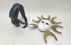 A plaster moulded wall-hanging face mask with additions of gilt sun rays (d. 42cm), together with