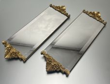A pair of modern wall hanging elongated mirrors in the Rococo style, the mirror plate complete