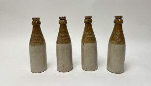 A collection of four 'W.M Murray & Co Craigmillar Brewery, Edinburgh' two-tone stoneware beer