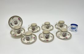 A collection of Crown Ducal coffee cups and saucers in the 'Indian Tree' pattern, together with a