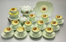 A Foley Bone China mint green with rose spray to centre part tea service comprising, a teapot, a