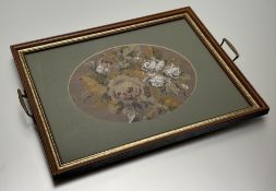 An galazed frame two handled tray with inset oval 19thc sewnwork panel with beaded white roses: l. x