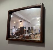 A mahogany-framed wall hanging rectangular convex mirror (l. 46cm x h. 38cm)