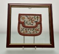 A pair of clear glass mounted 19thc Chinese silk embroidered purses worked in coloured threads