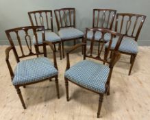 A set of six Edwardian mahogany dining chairs, four plus two carvers each with arched top rail and