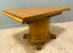 A mid-century oak draw-leaf dining table, by E-Gomme (later G-Plan), rectangular top over two