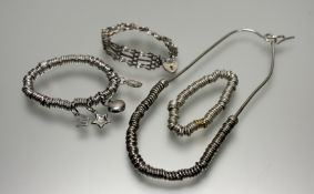 A collection of silver jewellery to include a ring mounted expanding charm style bracelet with