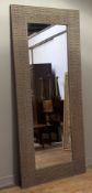 A Frank Hudson for John Lewis large rectangular hall mirror, with a oak carved geometric border with