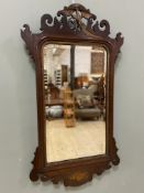 A Georgian-style mahogany fretwork mirror, the top with gilded phoenix, the original beveled