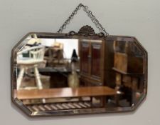 An Art Deco rectangular mirror, with cut corners, a bevelled glass panel, with shell decoration to