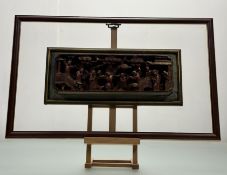 A framed 19thc Chinese hand-carved wooden red and gilt wall panel depicting Children Playing in