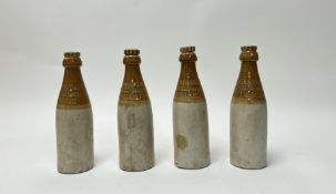 A collection of four 'W.M Murray & Co Craigmillar Brewery, Edinburgh' two-tone stoneware beer