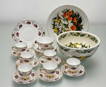 A Roslyn China part tea service decorated with roses and gilt swags comprising, six teacups, six