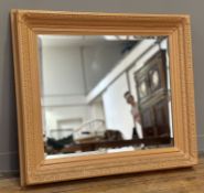 A Decorative Hall Mirror with a peach cream painted composition frame with bevelled glass mirror