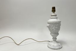 A plaster moulded table lamp in the Neo-Classical style, moulded with cherubs and scroll detail (